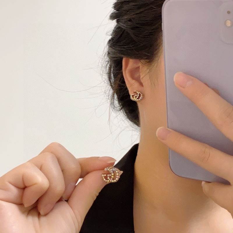 G*u*i earrings